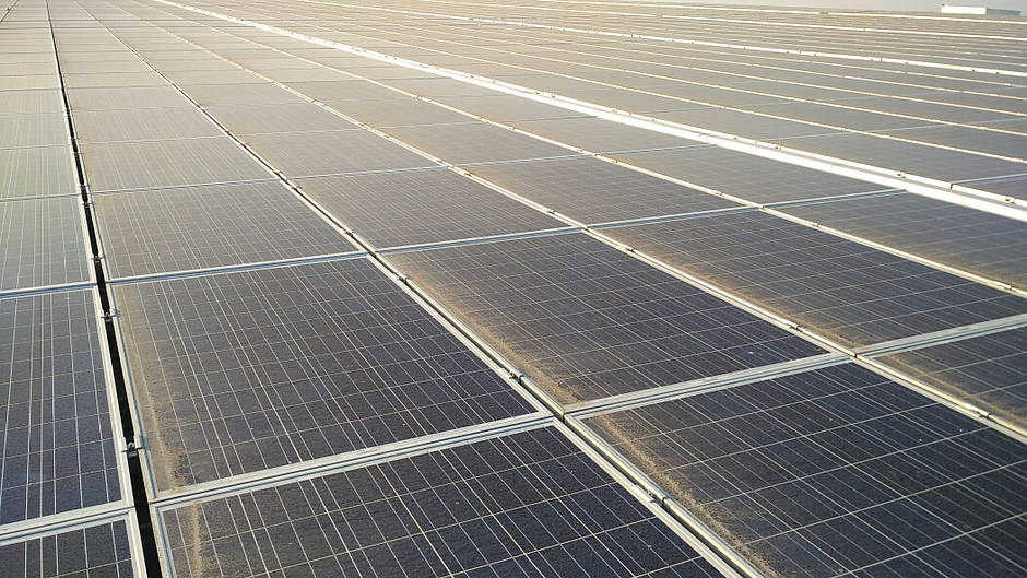 Side-by-side comparison of clean versus dirty solar panels showing efficiency difference